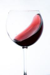 wine in glass on white background