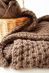 Obraz premium Knitting. Knitting. Knitted scarf. Brown scarf. Knitted pattern