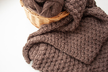 Knitting. Knitting. Knitted scarf. Brown scarf. Knitted pattern