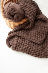 Fototapeta na wymiar Knitting. Knitting. Knitted scarf. Brown scarf. Knitted pattern