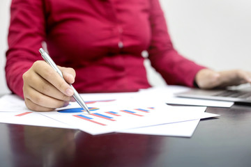 Business women working with financial reports at office.