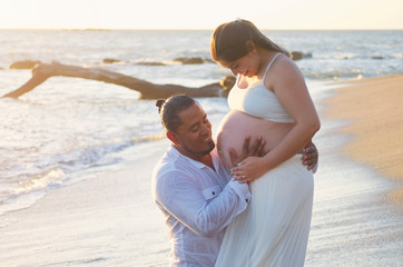 Hispanic pregnant woman with husband