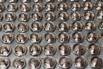 Tip for paint spray gun manufacture for CNC machine. Detail of spray gun parts.