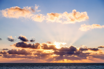 Naklejka na ściany i meble Beautiful sunset with God rays over Mediterranean sea. Gozo island, Malta.