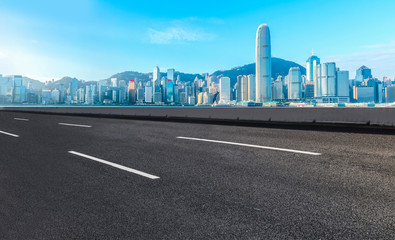 Fototapeta premium Road and skyline of modern urban architecture in Hong Kong..