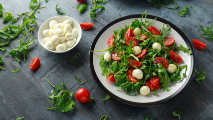 Chorizo salad with cherry tomatoes, mozzarella and wild rucola
