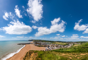 BRIDPORT, DORSET, UK - 6JUN2018: West Bay from cliffs to the East. Inland, the town of Bridport can also be seen.