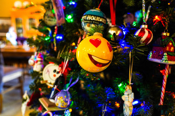 Smiley ornament on a Christmas tree