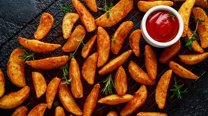 Paprika potato wedges fries chips, with ketchup and thyme