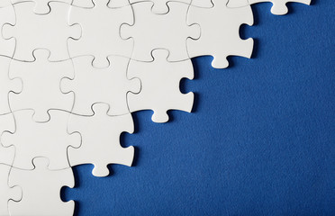 White puzzles on blue background