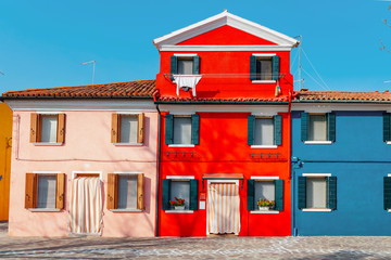 Famous Colorful houses as tourist landmark on Burano island, Venice region. Travel in Italy