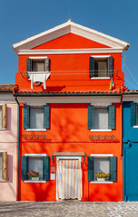 Famous Colorful houses as tourist landmark on Burano island, Venice region. Travel in Italy