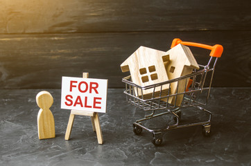 Supermarket cart with houses and man with a poster for sale. The concept of selling a home, real...