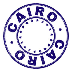 CAIRO stamp seal imprint with distress texture. Designed with circles and stars. Blue vector rubber print of CAIRO tag with retro texture.