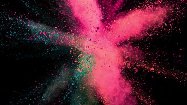 Super slow motion of coloured powder explosion isolated on black background. Filmed on high speed cinema camera, 1000 fps.