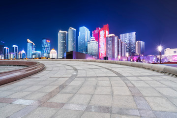 Empty Plaza Floor Bricks and the Skyline of Modern Urban Architecture in Qingdao..