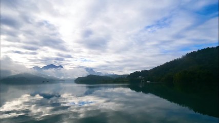 4K Time lapse beautiful landscape of mountain and lake with reflection in the morning
