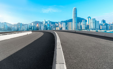 Road and skyline of modern urban architecture in Hong Kong..