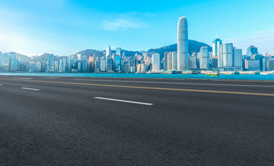 Fototapeta na wymiar Road and skyline of modern urban architecture in Hong Kong..
