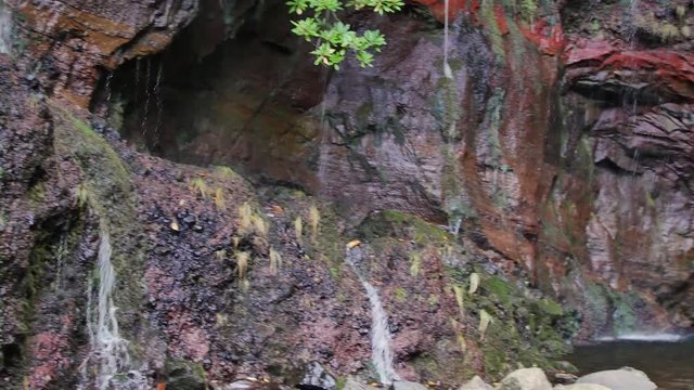 25 Fontes falls on Madeira. Beautiful waterfall in the midlle of green hills and woods.