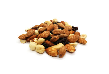 Mix of nuts hazelnut almonds and cashews with raisins, a bunch isolated on a white background.