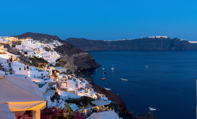 Naklejka premium Oia village at the sunset - Aegean sea - Santorini island - Greece