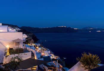 Fototapeta premium Oia village at the sunset - Aegean sea - Santorini island - Greece