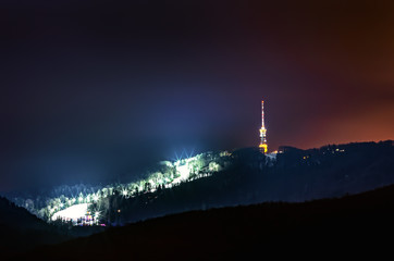 Fototapeta premium Night shot of Medvednica mountain in Zagreb with snow quenn ski slope