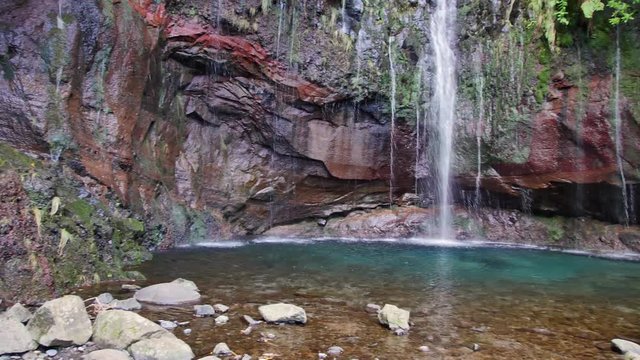 25 Fontes falls on Madeira. Beautiful waterfall in the midlle of green hills and woods.