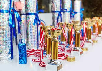 Reward gifts and cups are prepared for ceremony on sport competition tournament and medals