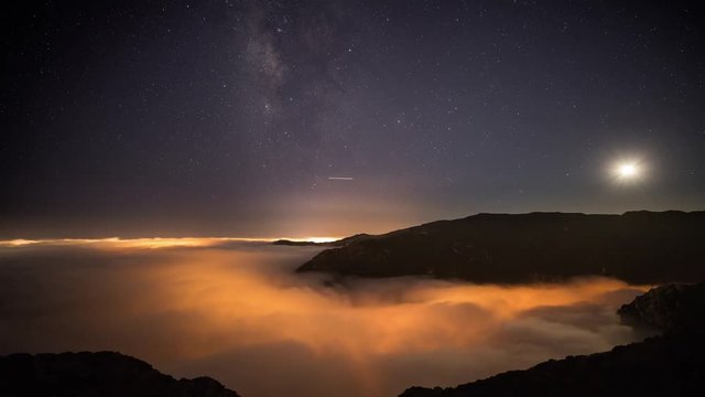 Night time lapse of a road winding through the mountains in Malibu California.
