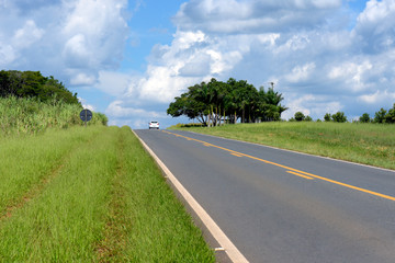 Perspective of highway with isolated car on the horizon