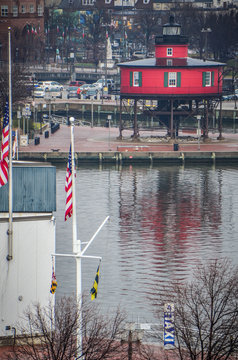 Portrait view of Seven Foot Knoll Lighthouse in Inner Harbor from across the water