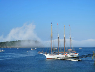 Fog Lifts from Bar Harbor, where a schooner is docked.