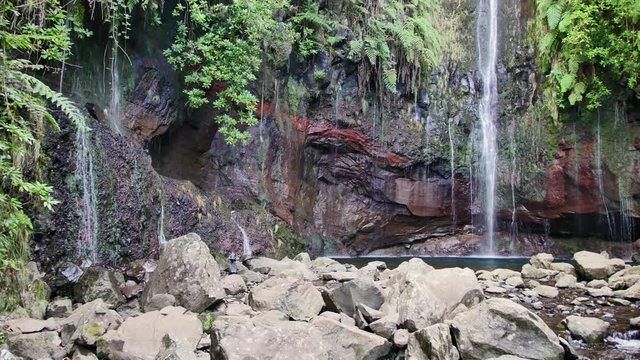 25 Fontes falls on Madeira. Beautiful waterfall in the midlle of green hills and woods.