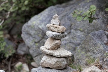 Cairn made of grey granite stones.