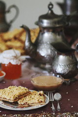 Grated pie served with coffee and jam