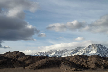 Eastern Sierra Nevada snowy mountain peaks and brown winter hills