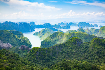 Fototapeta na wymiar scenic view over Ha Long bay from Cat Ba island, Ha Long city in the background, UNESCO world heritage site, Vietnam