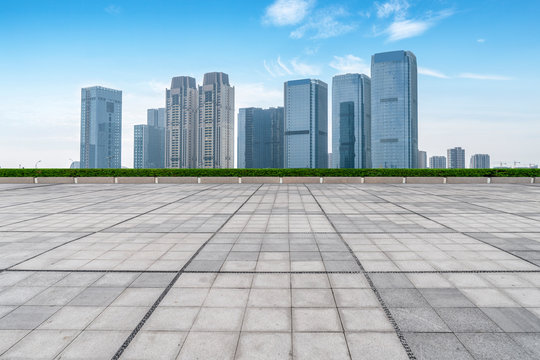 Empty Plaza floor tiles and the skyline of modern urban buildings in Hangzhou.. © 昊 周
