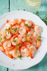 boiled shrimps on wooden surface