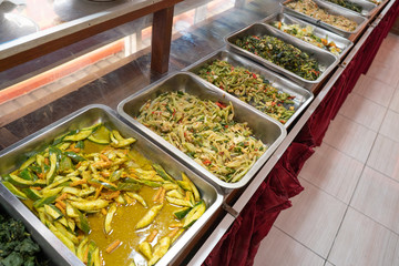 portrait many kind of indonesian food on serving tray in the restaurant