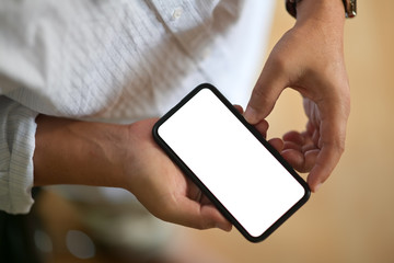 Closeup of male hands holding blank screen mobile smart phone