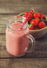 strawberry milk shake on wooden surface