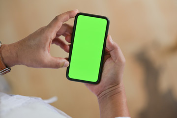 Top view of Man standing and using mobile smart phone