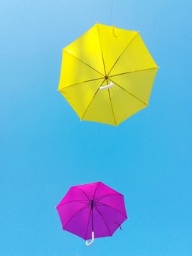 Colorful umbrellas floating on the air