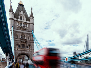 London in summer at Tower bridge with motion blur effect of tourist and cars