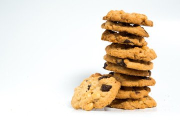 A stack of chocolate chip cookies isolated on a white background