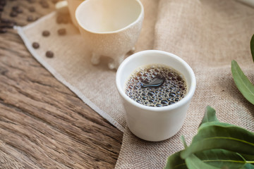 Fototapeta na wymiar Drip hot coffee on a cup for drinking.