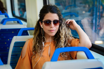 Young woman traveling by train. People lifestyle.